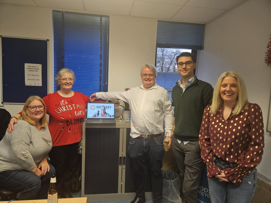 Colleagues in Christmas jumpers in the office