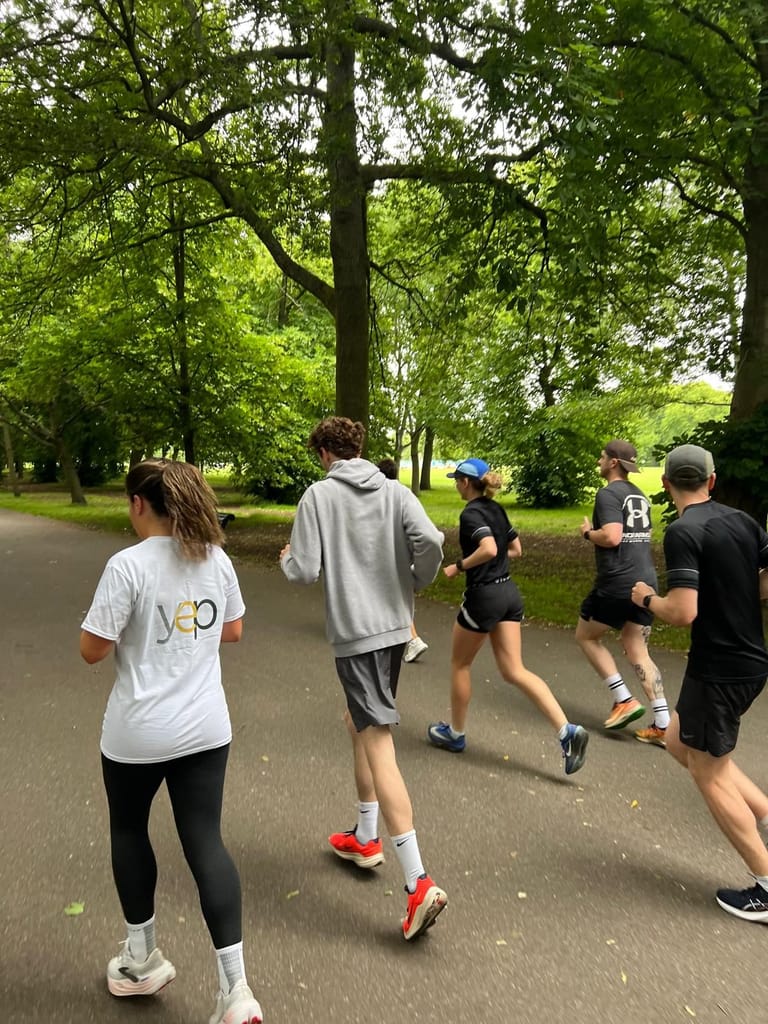 Runners setting off through the park